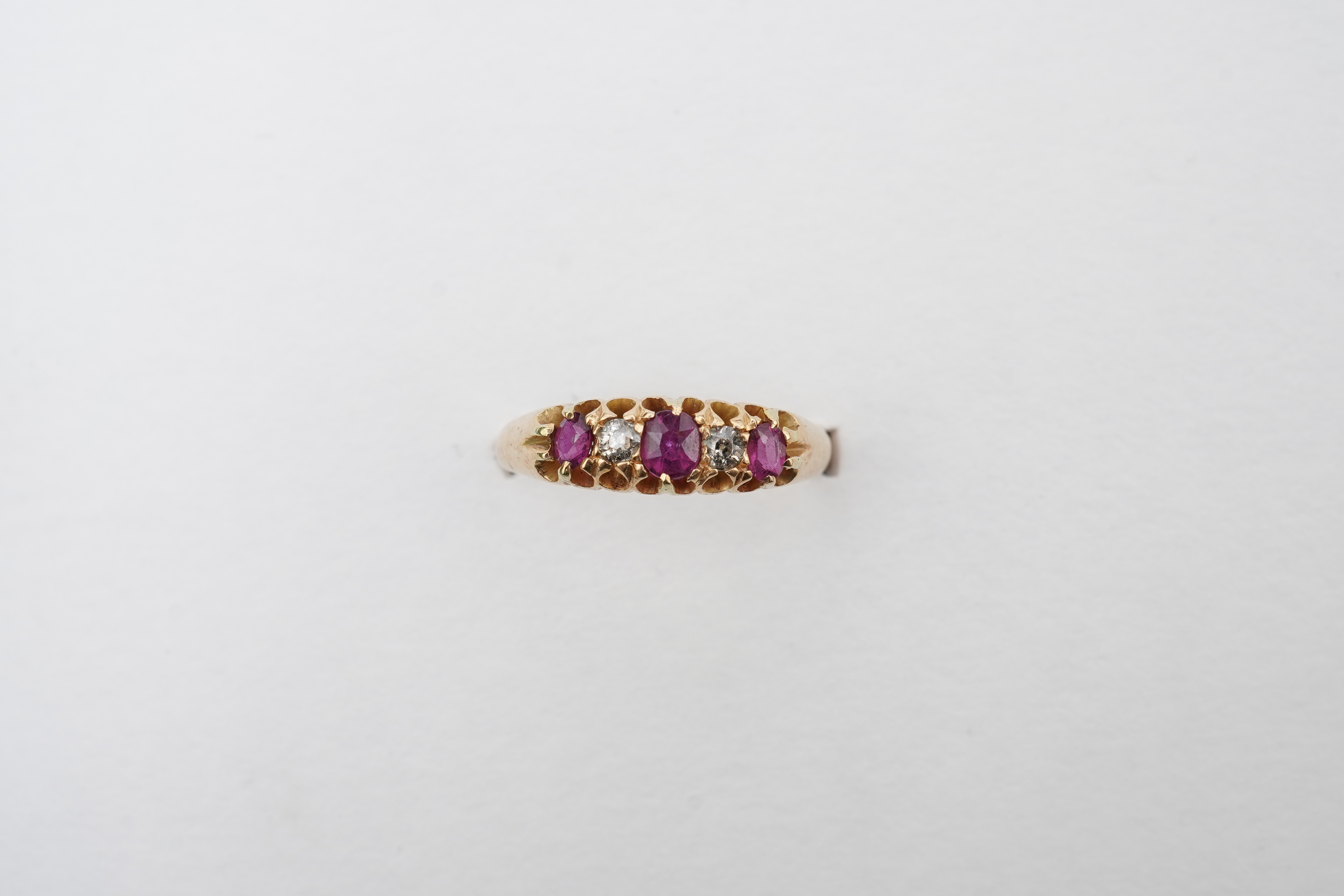 A ruby and diamond five-stone ring, circa 1900